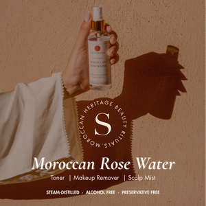 Skalli Essentials Moroccan Rose Water held against a sunlit wall: toner, makeup remover, scalp mist. Steam-distilled, alcohol free.