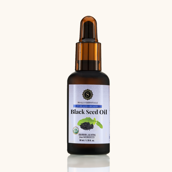A 50ml bottle of Skalli Essentials' pure and organic Black Seed Oil, shown without packaging, featuring the cold-pressed, solvent-free formula.