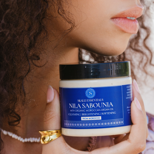 Skalli Essentials Nila Sabounia soap applied on the skin for gentle exfoliation and brightening, with natural Moroccan ingredients.