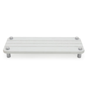 Skalli Essentials white bathroom organizer shelf with stainless steel legs, perfect for placing toiletries or small accessories in a modern bathroom setting.